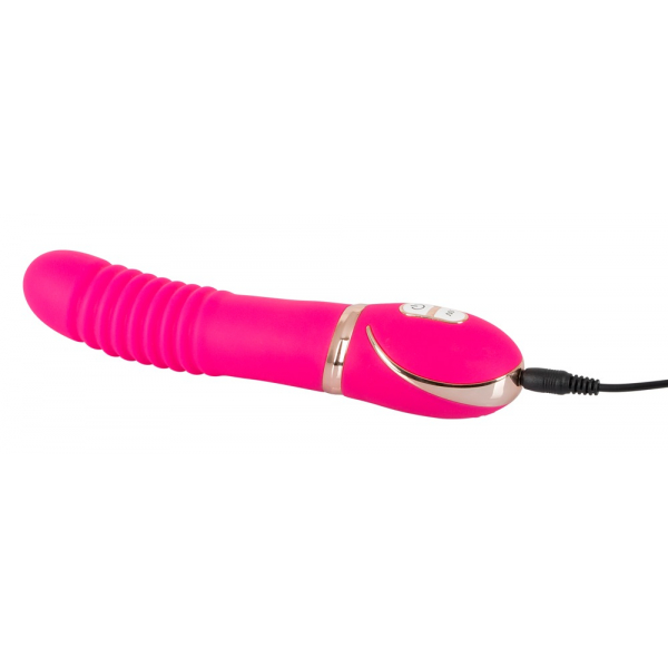 Vibrator roza barve s kablom za polnjenje.
